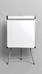 A blank, portable whiteboard stand stands ready for use in front of a light gray wall, minimalist and clean in a studio environment