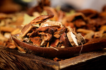Dried Spices Collection with Cinnamon and Star Anise in Rustic Wooden Bowls