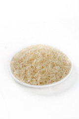 Long Grain Basmati Rice in White Bowl Isolated on White Background