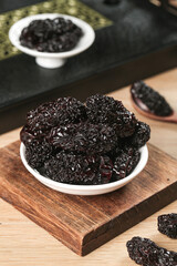 Large Dried Black Jujube Dates in Bowl on Wooden Board - Chinese Superfood Ingredient