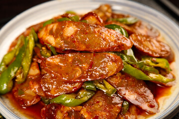 Handmade Spicy Sichuan Sausage Stir Fry with Green Peppers Traditional Chinese Food