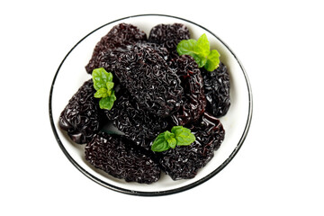 Big Black Dried Jujube Dates from Xinjiang China with Mint Leaves in White Bowl