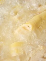 Fresh Peeled Bamboo Shoots Sliced for Cooking - Asian Vegetable Ingredient Photo