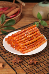 Spicy Dried Meat Sticks Traditional Handmade Asian Snacks on Wooden Table with Star Anise