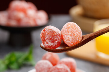 Sugar Coated Kumquat Preserves on Wooden Spoon - Traditional Candied Citrus Fruit Confectionery