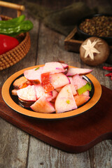 Shandong Style Heart Radish Salad - Traditional Chinese Vegetable Dish with Special Cream Dressing on Rustic Wooden Table