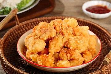 Crispy Golden Fried Chicken Legs with Salt Crust on Wicker Platter