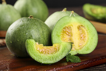 Fresh Green Shandong Lvbao Melon Slices on Wooden Board - Sweet Summer Fruit