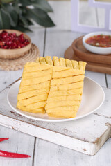 Dried Bean Curd Tofu Skewers with Chili Sauce and Pomegranate Seeds Studio Food Photography