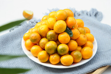 Fresh Kumquat and Rongan Citrus Fruits on White Plate - Healthy Organic Produce Photography