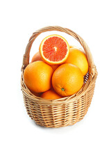 Fresh Orange and Red Grapefruit in Wicker Basket Isolated on White Background