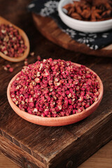 Sichuan Hanyuan Dahongpao Peppercorns Display in Wooden Bowls on Rustic Kitchen Board
