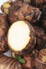 Fresh Hairy Taro Roots from Shandong China Market Display Traditional Asian Vegetable Ingredient