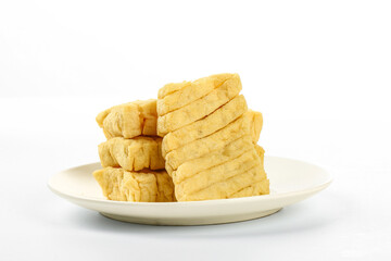 Dried Bean Curd Sticks on White Plate - Traditional Asian Tofu Food Ingredient