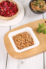 Japanese Natto Fermented Soybeans with Mixed Grain Presentation on Wooden Board