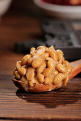 Japanese Natto Fermented Soybeans on Wooden Spoon - Traditional Asian Food