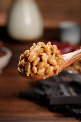 Japanese Natto Fermented Soybeans on Wooden Spoon Traditional Asian Food