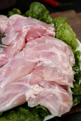 Fresh Raw Rabbit Foreleg Meat on Lettuce Leaves Ready for Cooking