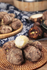 Fresh Taro Roots from Shandong China on Wicker Basket Traditional Asian Kitchen Vegetables