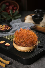 Dried corn silk cornhusk in wicker basket for herbal tea brewing and traditional natural health remedies