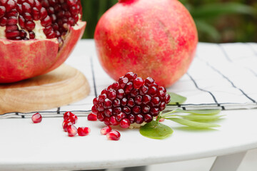 Fresh Pomegranate Seeds and Arils Display on White Marble Surface - Healthy Organic Superfruit