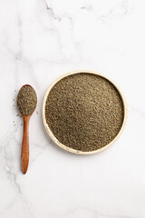 Mixed Highland Millet Grains in Wooden Bowl - Organic Black Superfood Seeds on Marble Surface