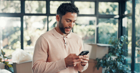 Phone, happy and man in home with networking, communication or chatting on mobile app. Technology,...