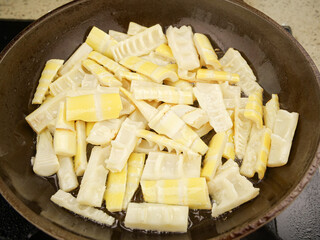 Fresh Bamboo Shoots Cooking in Pan - Asian Spring Vegetable Preparation