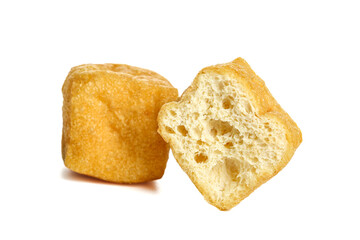 Crispy Golden Fried Tofu Puffs Cut in Half Showing Hollow Texture on White Background