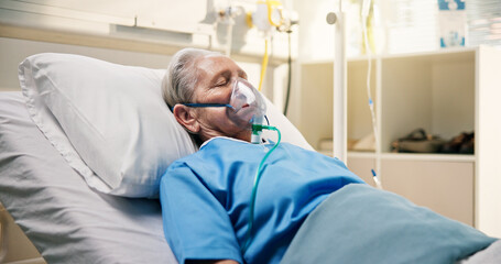 Oxygen mask, illness and old woman in hospital bed, healthcare and breathing support. Pensioner, elderly patient and person in clinic, ventilation or surgery recovery with medical help, lungs or rest