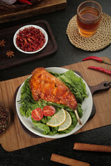 Szechuan Spiced Rabbit Leg with Fresh Vegetables and Traditional Chinese Tea Setup