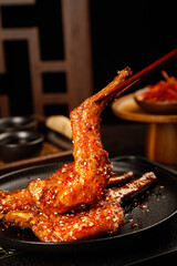 Spicy Szechuan Roasted Rabbit Legs with Chili Glaze - Traditional Chinese Cuisine Dish