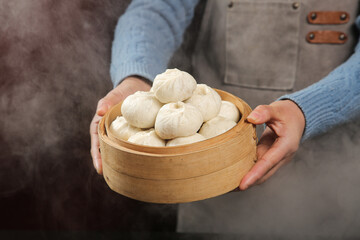 Traditional Chinese Xiaolongbao Dumplings in Bamboo Steamer - Fresh Dim Sum Cuisine