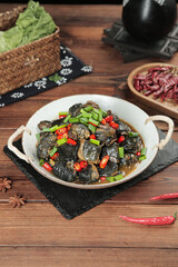 Asian Braised Mushroom Stir Fry with Chilies and Scallions in Traditional White Bowl