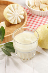 Fresh White Guava Juice with Cream Heart Steamed Buns and Tropical Fruit on Wooden Table