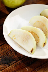 Fresh Sliced Guava Fruit with Soft White Flesh on White Plate - Tropical Healthy Eating