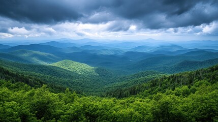 Fototapeta premium Mountain Range Panorama; Vast Forest Landscapes, Dramatic Cloudscape. Use for Nature, travel, wallpaper