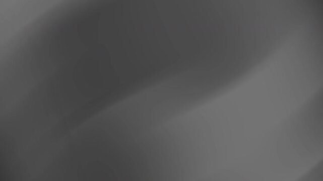 Dark gray abstract background ideal for tech presentations or website design projects, featuring blurred light patches for a sophisticated look.