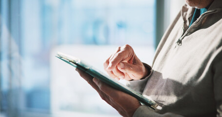 Hands, typing and man in office with tablet, online scroll or planning for client. Space, digital or marketing consultant in agency with tech, presentation prep or message update on virtual app.