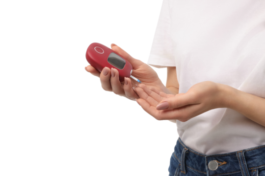 Using a portable blood glucose meter, isolated on white, PNG