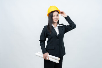 The portrait of an Asian female engineer in a white background studio shows her carefully analyzing a blueprint, reflecting dedication and expertise essential for growth in the industry.