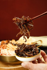 Liuzhou Snail Rice Vermicelli with Kelp and Chopsticks - Traditional Chinese Specialty Dish Side View