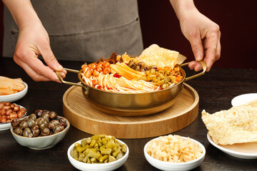 Liuzhou Snail Noodle Soup with Vermicelli Peanuts Bean Curd Traditional Chinese Cuisine Chef Serving Specialty Dish