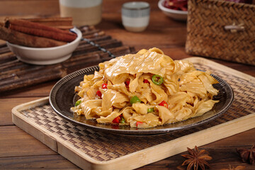 Fried Bean Skin Noodles Asian Cuisine Traditional Chinese Food Dish with Vegetables and Chopsticks