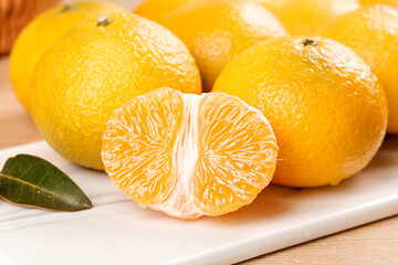 Fresh Orange Citrus Fruits from Fujian Ganzhou - Sweet Tangerine Pomelo on White Plate