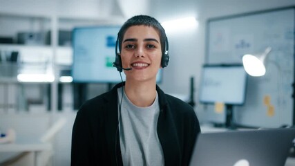 POV of Female Customer service representative wearing headset smiling and using laptop for customer service in call center office. Businesswoman Support agent talking to customer, CRM, Telemarketing.