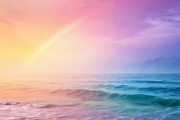 Vibrant rainbow arches over a serene ocean at sunrise