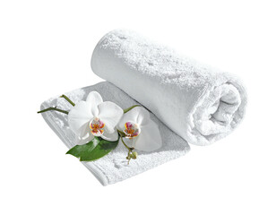 Rolled white bath towels with orchids