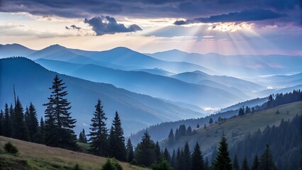 Obraz premium Majestic mountain ranges bathed in ethereal blue hues, with sunbeams piercing through dramatic clouds and evergreen trees dotting the rolling hills below.