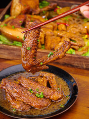 Marinated Grilled Meat with Chopsticks - Asian Cuisine Cooking and Food Preparation